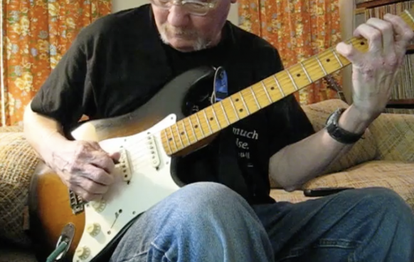 Jim Duckworth playing electric guitar