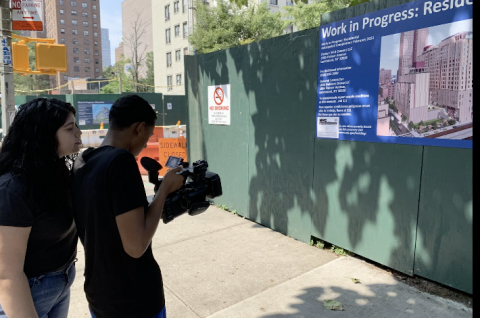 youth producers filming in neighborhood under construction