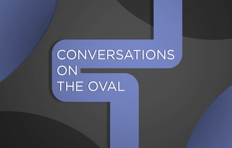 Conversations on the Oval with blue and black abstract designs