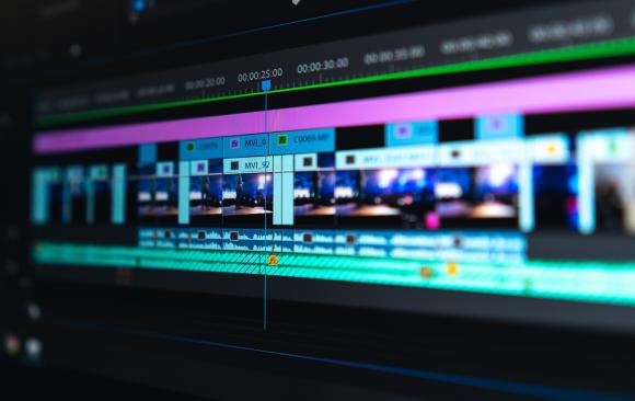 Close up photo of a computer screen showing a timeline in Adobe Premiere