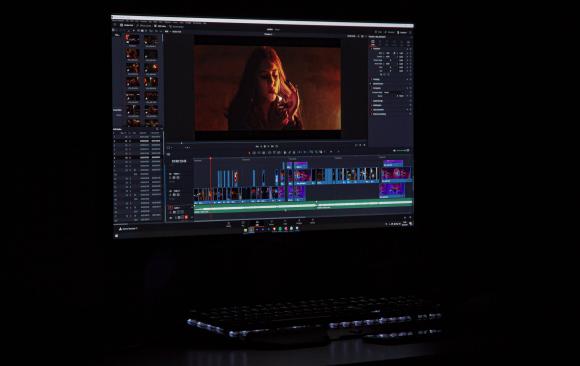 Photo of a computer screen showing a DaVinci Resolve video editing timeline (Photo by Daniel Leżuch on Unsplash)